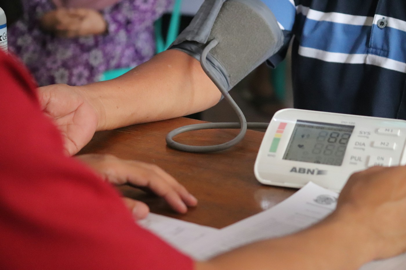 Blood pressure being measured with an arm cuff and digital monitor